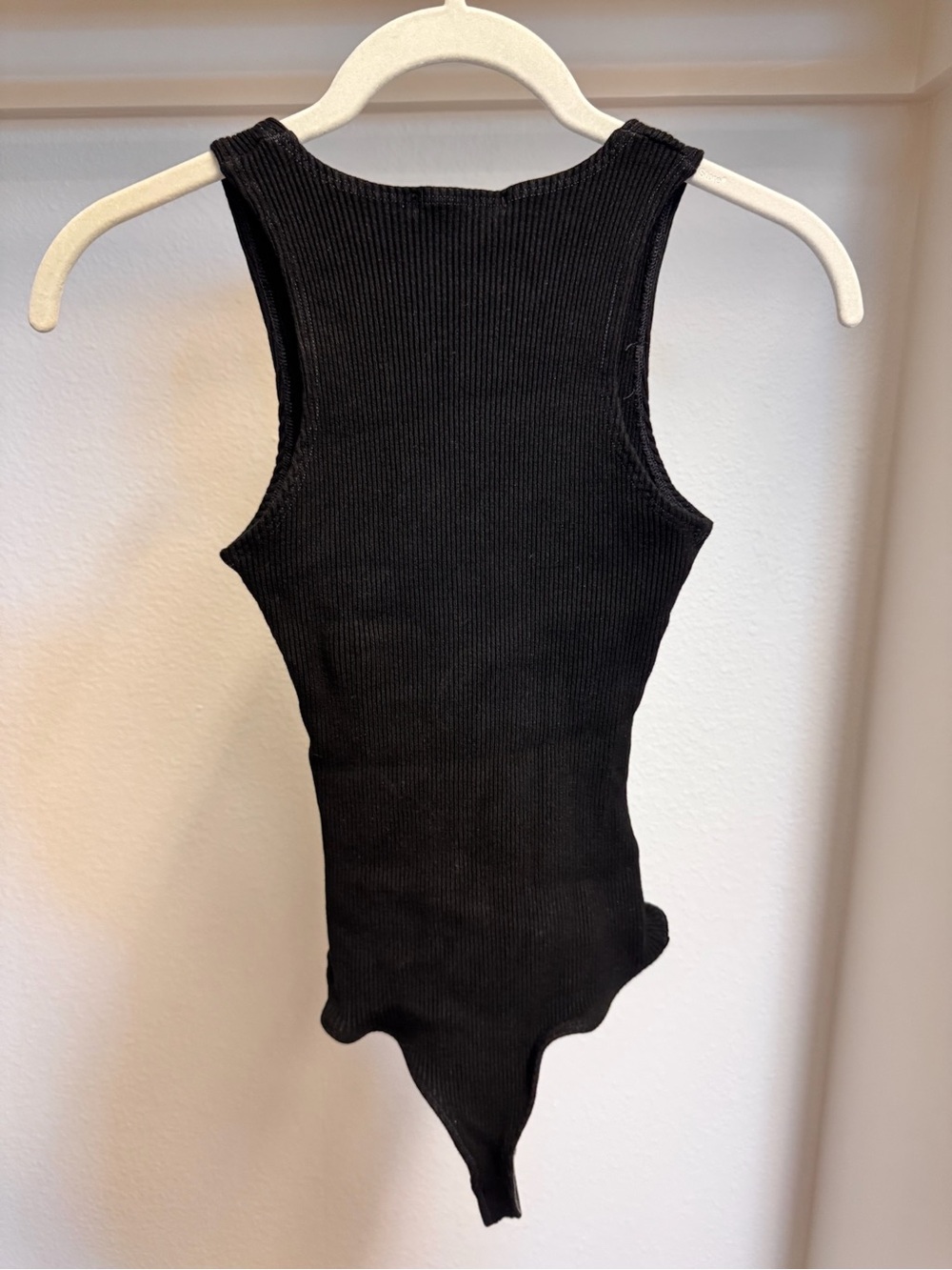 Women’s Black Ribbed One-Piece Bodysuit